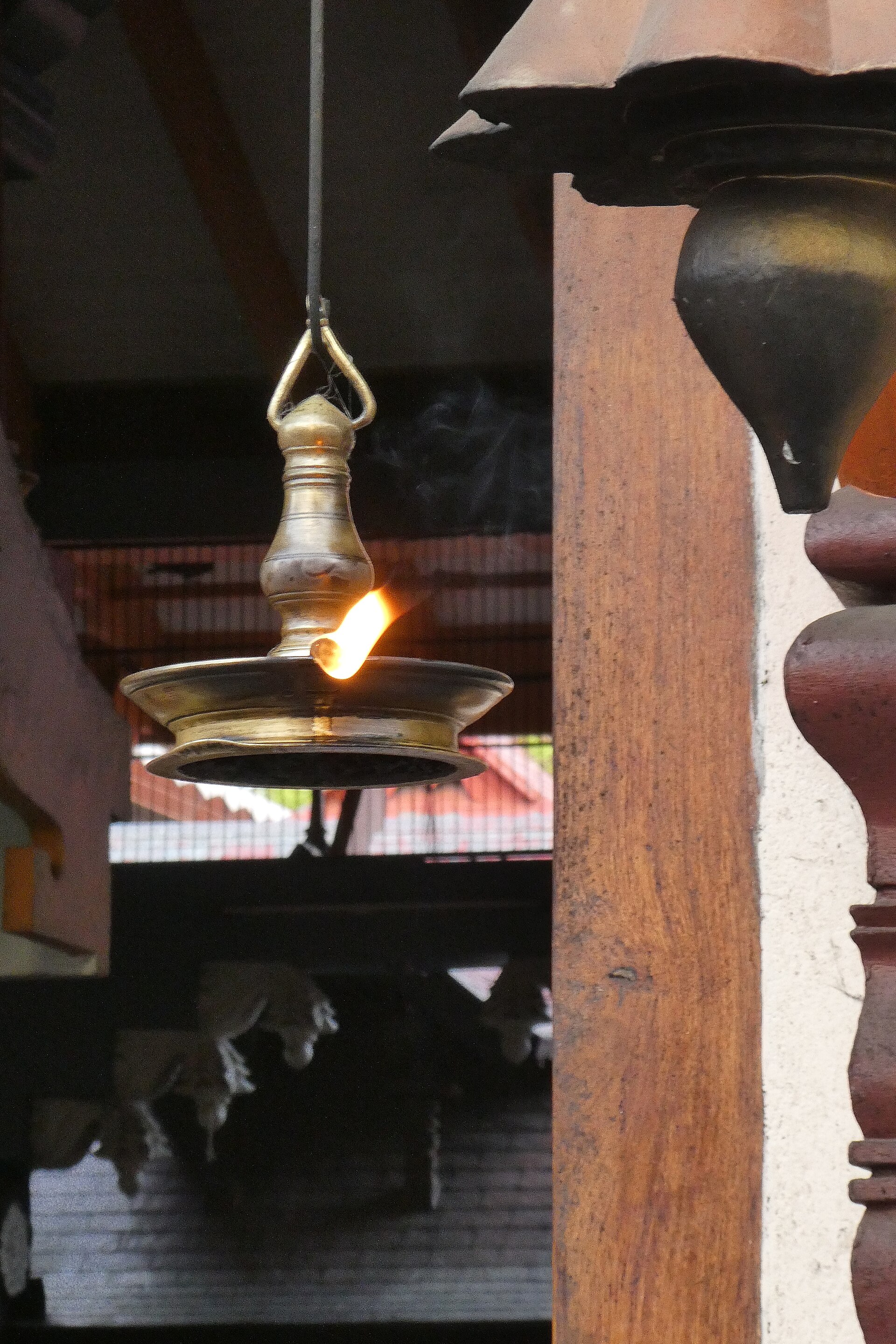 A traditional lamp glowing at Guruvayur Sree Krishna Temple